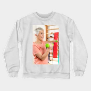 Senior woman exercising with dumbbells (F024/9971) Crewneck Sweatshirt